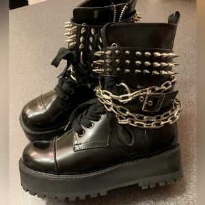 Black combat boots with chains and spikes